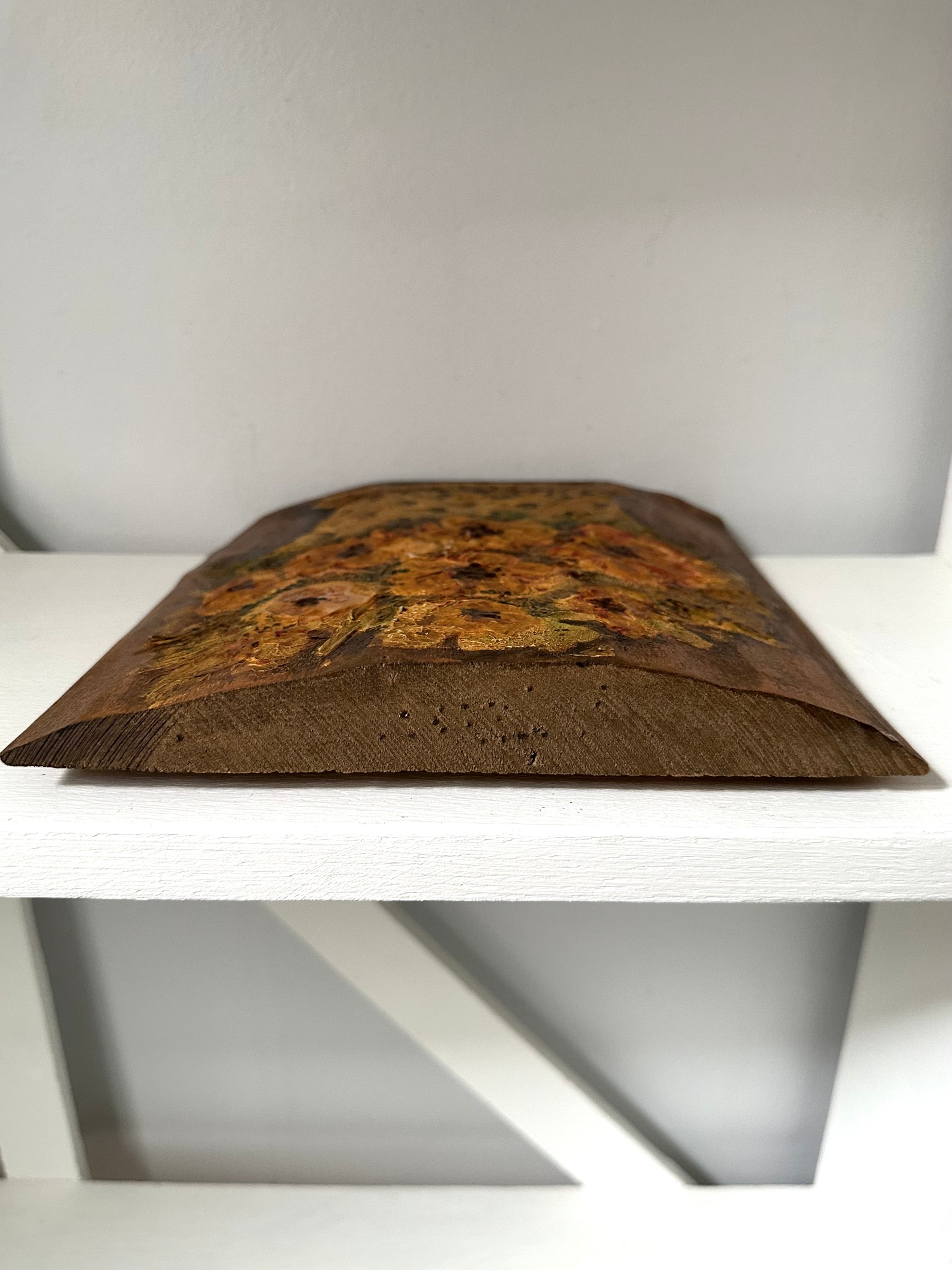 Decorative pillow with a floral pattern on a white shelf