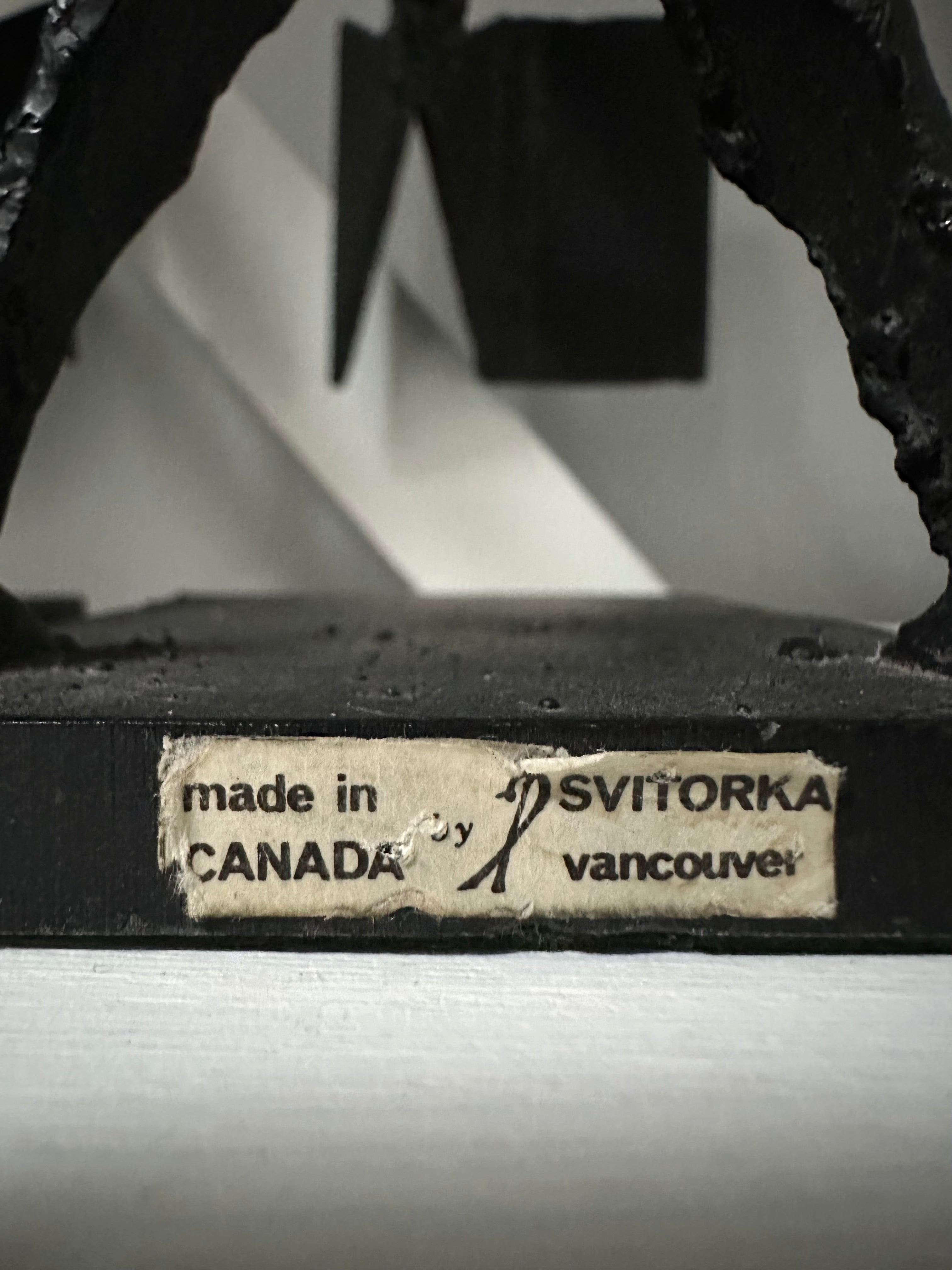 Close-up of a label on a sculpture with &