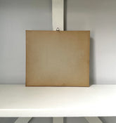 Brown cardboard box on a white surface with a gray background