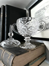 Ornate Vintage Glass on Stack of Antique Books