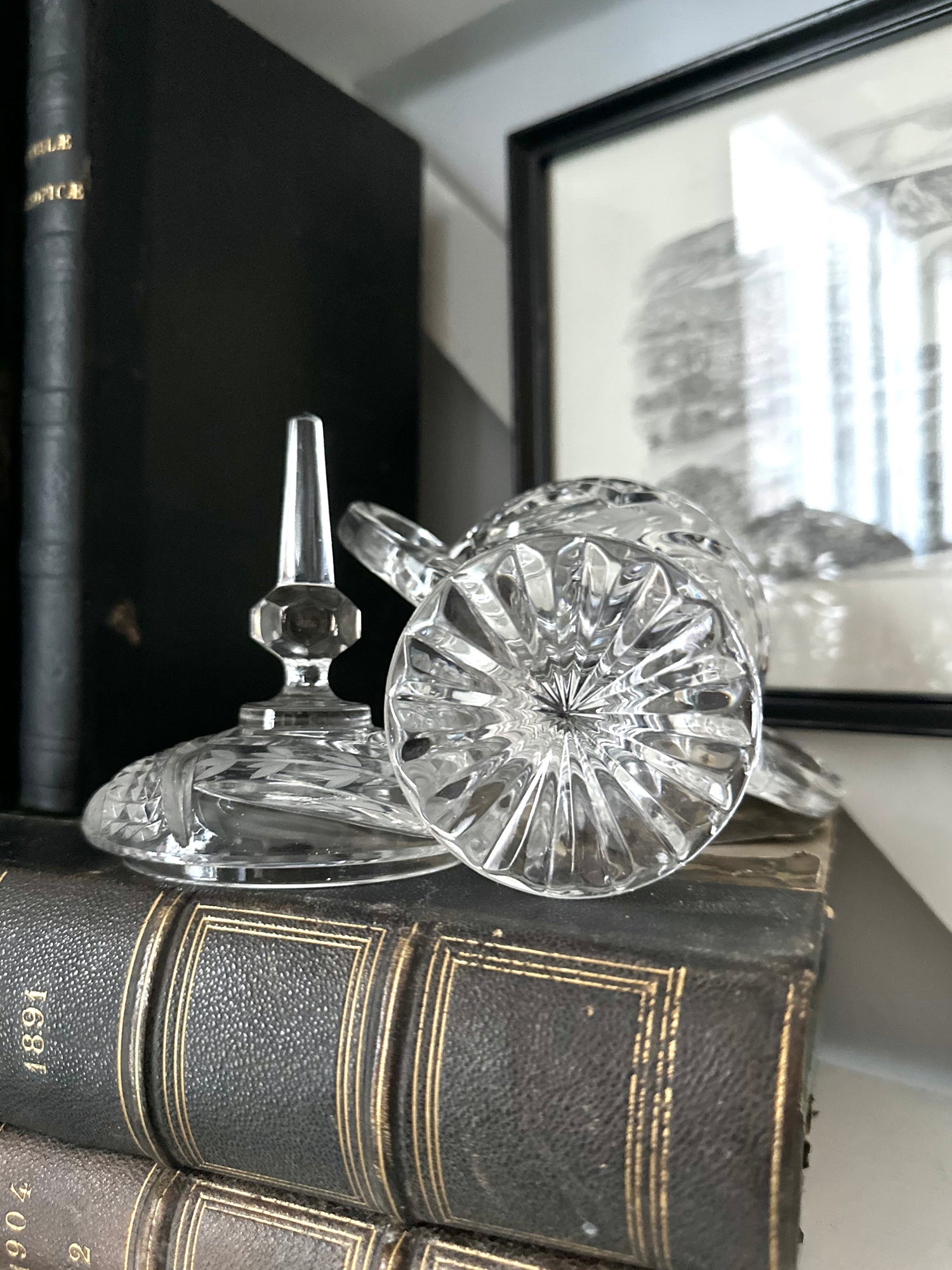 Glassware Sitting on top of Antique Books