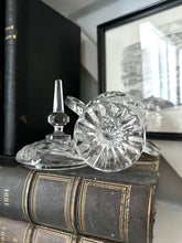 Glassware Sitting on top of Antique Books