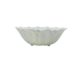 White ceramic bowl with scalloped edge on a white background