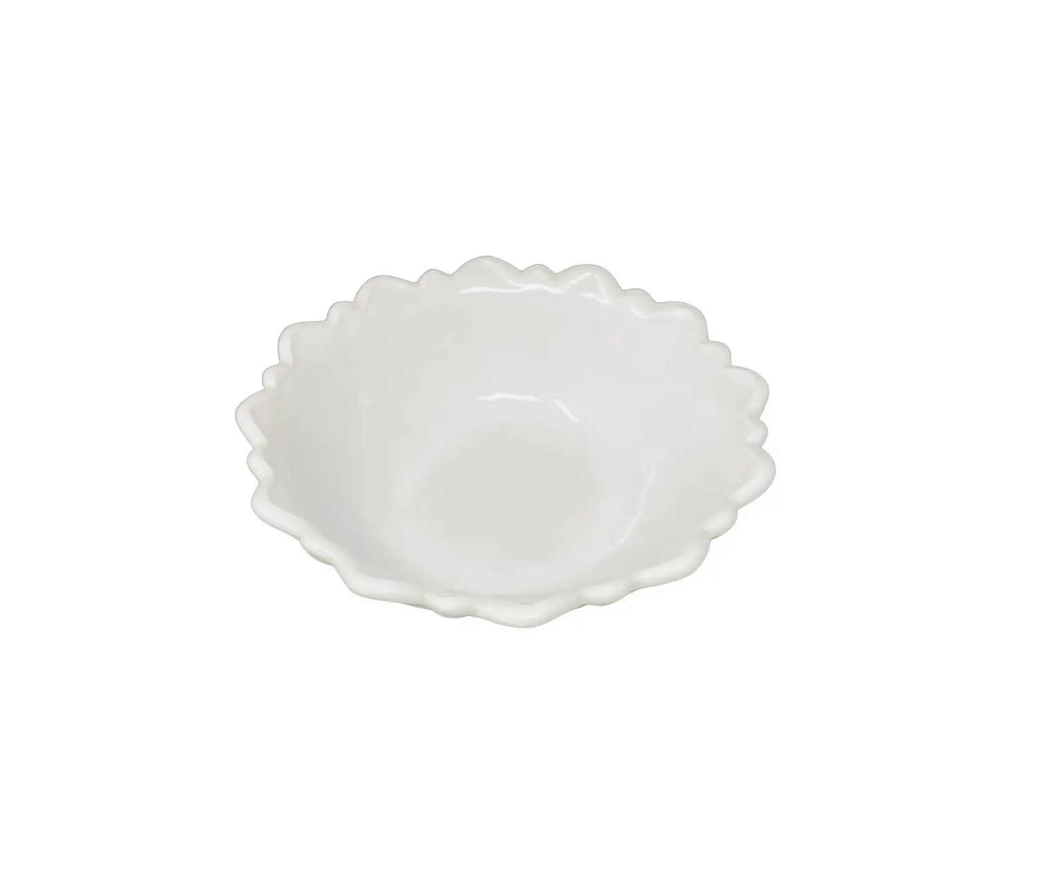 White ceramic bowl with scalloped edge on a white background