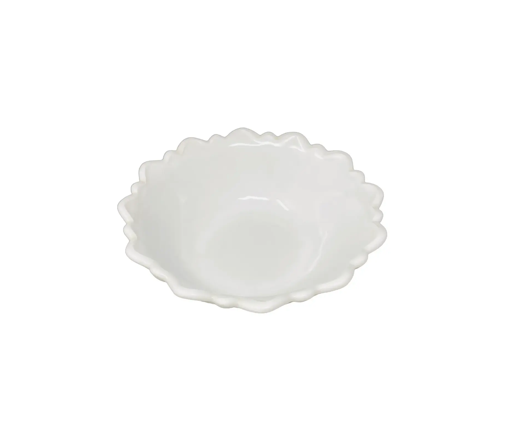 White ceramic bowl with scalloped edge on a white background