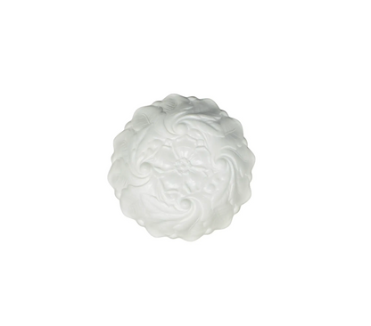 White decorative item resembling a cloud on a white background