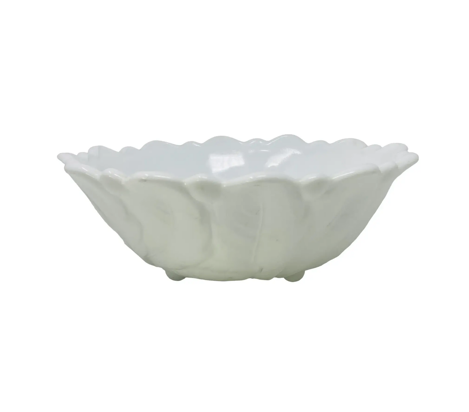 White ceramic bowl with scalloped edge on a white background
