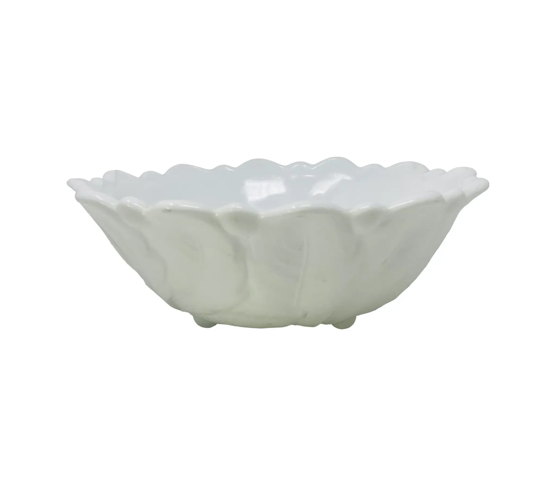 White ceramic bowl with scalloped edge on a white background