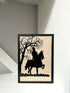 Framed silhouette art of a person on a horse under a tree